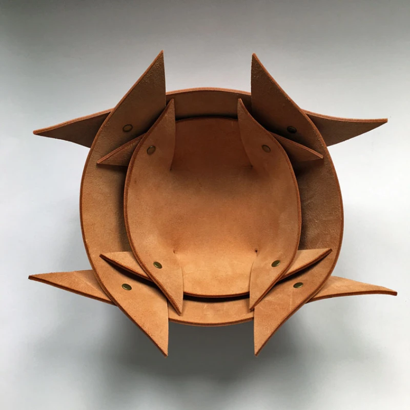 Tan leather nesting bowls