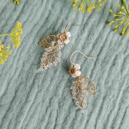 Foglia and frond earrings by Judith Brown
