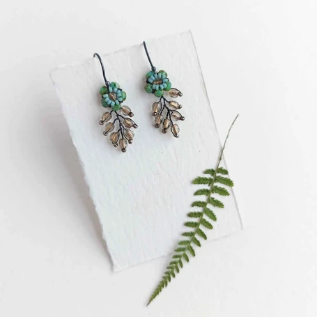Beaded foliage earrings by Judith Brown