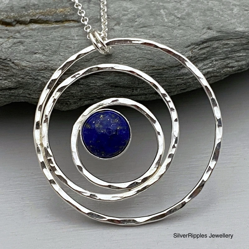 Eccentric circles silver pendant with Lapis Lazuli centre