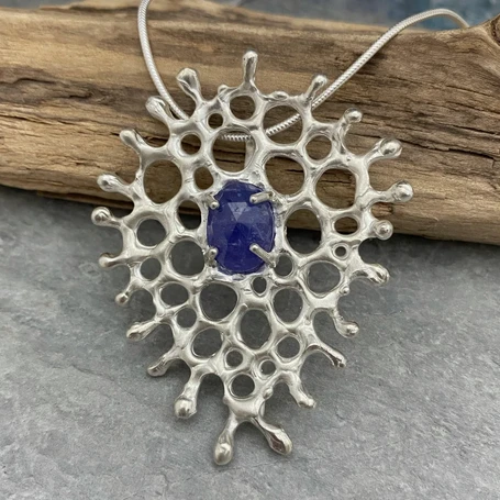 Sterling silver organic pendant with a tanzanite stone