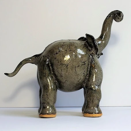 small ceramic plain elephant with trunk up