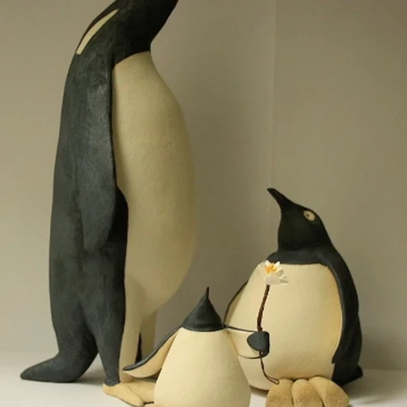 family of ceramic penguins